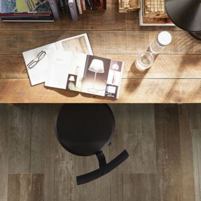 wood look tile flooring in a home office with rustic wood desk